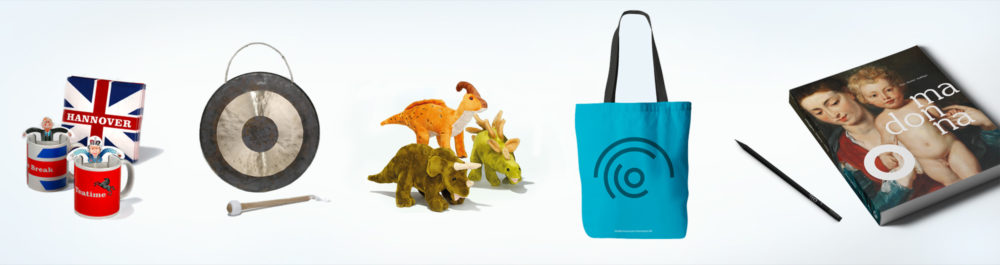 Items that can be purchased in the museum shop include cups and napkins, stuffed animals, bags and catalogs.