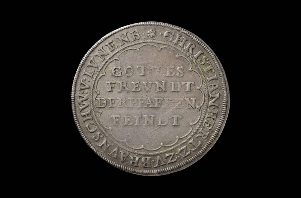 Münze mit Aufschrift 